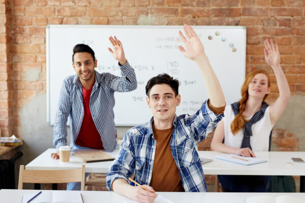 Students raising their hands